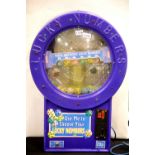 Novelty lucky number generating machine to choose random lottery numbers, H: 90 cm. This lot is