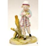 Continental figurine of a boy, H: 18 cm. P&P Group 2 (£18+VAT for the first lot and £2+VAT for