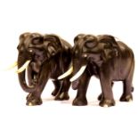 Pair of antique ebony carved elephants with ivory tusks. P&P Group 3 (£25+VAT for the first lot