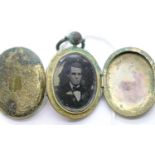 Victorian brass double sided mourning locket with photo in one side and lock of hair in the other.