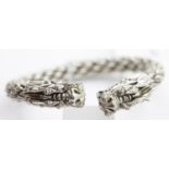 Tibetan silver twisted white metal torc bangle with dragon finials. D: 9 cm. P&P Group 1 (£14+VAT