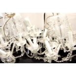 Pair of mid 20thC cut glass chandeliers, each having twelve sconces with drops on a glass and