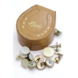 Leather stud box containing yellow metal and gold studs. P&P Group 1 (£14+VAT for the first lot