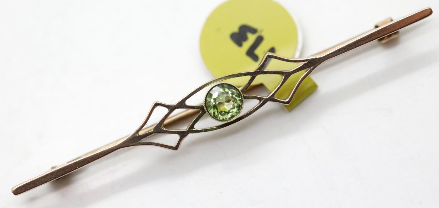 Antique 9ct rose gold peridot set fancy brooch, L: 55 mm, 2.4g. P&P Group 1 (£14+VAT for the first