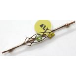 Antique 9ct rose gold peridot set fancy brooch, L: 55 mm, 2.4g. P&P Group 1 (£14+VAT for the first