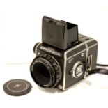 Bronica EC medium format camera with Nikkor 75 mm lens. P&P Group 2 (£18+VAT for the first lot