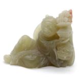 Carved jade Buddha holding a lamp, H: 6 cm. P&P Group 1 (£14+VAT for the first lot and £1+VAT for