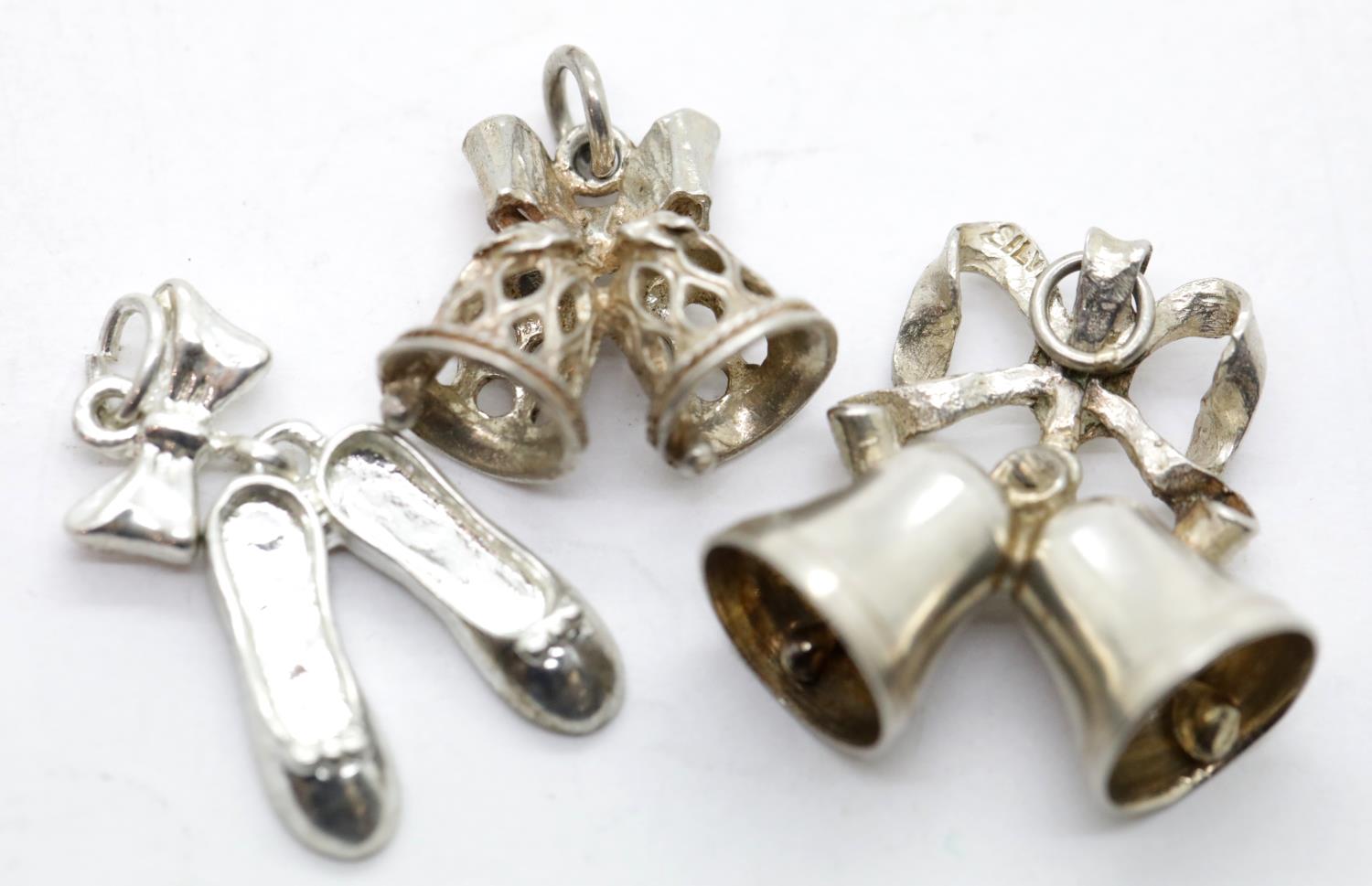 Three 1970s 925 silver assorted charms, 8.4g. P&P Group 1 (£14+VAT for the first lot and £1+VAT