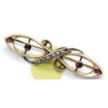 Antique 9ct rose gold, ruby and seed pearl brooch, L: 40 mm, 1.7g. P&P Group 1 (£14+VAT for the