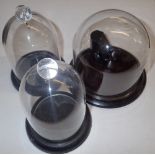 One glass and two plastic pocket watch display domes, largest D: 8 cm. P&P Group 1 (£14+VAT for