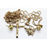 9ct yellow gold crucifix and a 9ct yellow gold butterfly pendant both on 9ct gold chains and a