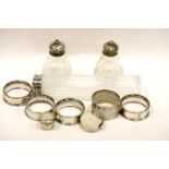 Silver cruet, silver pill pot and five white metal napkin rings. P&P Group 2 (£18+VAT for the