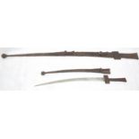 Two North African swords in elaborate leather scabbards with leather grips. P&P Group 3 (£25+VAT for