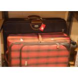 Two modern suitcases. This lot is not available for in-house P&P.