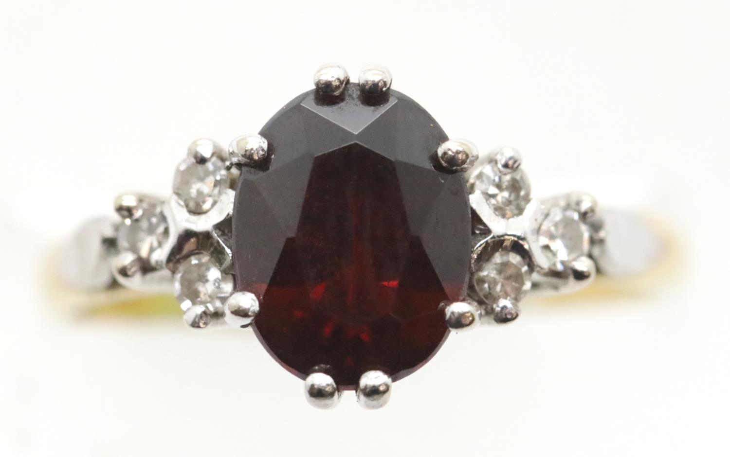 Ladies 18ct gold, fancy garnet and diamond ring, size O, 4.0g. P&P Group 1 (£14+VAT for the first