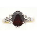 Ladies 18ct gold, fancy garnet and diamond ring, size O, 4.0g. P&P Group 1 (£14+VAT for the first