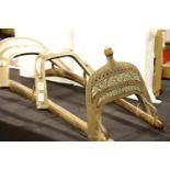 Antique Far Eastern brass with inlay double camel saddle. This lot is not available for in-house P&