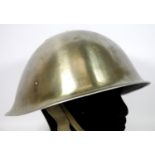 Polished metal Italian? helmet with liner and chinstrap. P&P Group 2 (£18+VAT for the first lot