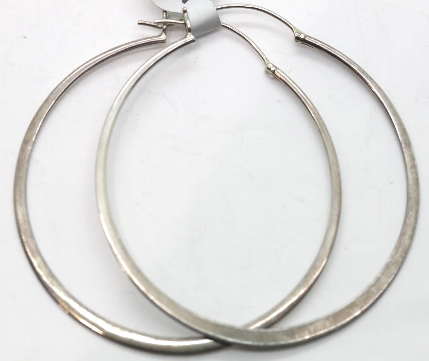 Pair of large loop 55 mm earrings. P&P Group 1 (£14+VAT for the first lot and £1+VAT for