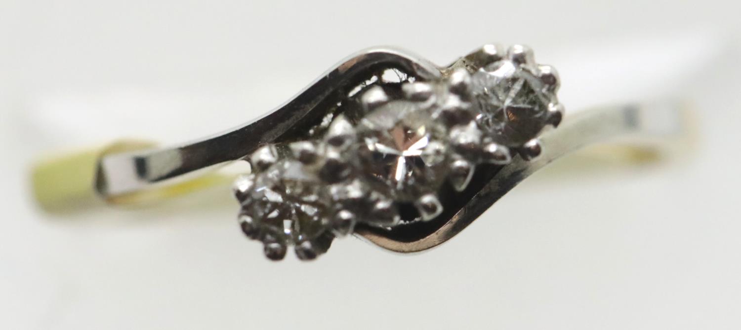 Antique 18ct gold and platinum three stone on a twist diamond ring, size K, 2.4g. P&P Group 1 (£14+