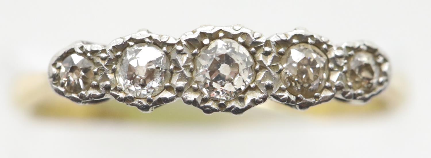 Antique 18ct gold and platinum 1920s five stone diamond ring, size P, 2.6g. P&P Group 1 (£14+VAT for