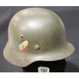 German WWII style helmet with liner, lacking chinstrap, swastika decals. P&P Group 2 (£18+VAT for