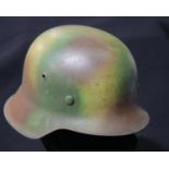 German WWII style helmet with liner and chinstrap. P&P Group 2 (£18+VAT for the first lot and £2+VAT