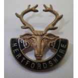 Enamelled Hertfordshire Regiment brooch. P&P Group 1 (£14+VAT for the first lot and £1+VAT for
