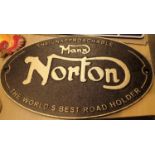 Cast iron Manx Norton sign, D: 24 cm. P&P Group 2 (£18+VAT for the first lot and £2+VAT for