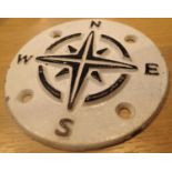 Circular cast iron compass points sign, D: 9 cm. P&P Group 1 (£14+VAT for the first lot and £1+VAT