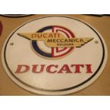 Cast iron Ducati sign, D: 20 cm. P&P Group 2 (£18+VAT for the first lot and £2+VAT for subsequent