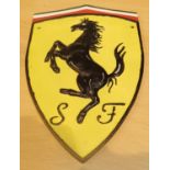 Cast iron Ferrari sign, H: 29 cm. P&P Group 2 (£18+VAT for the first lot and £2+VAT for subsequent