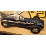 Cast iron Michelin Man racing car in blue, L: 27 cm. P&P Group 2 (£18+VAT for the first lot and £2+