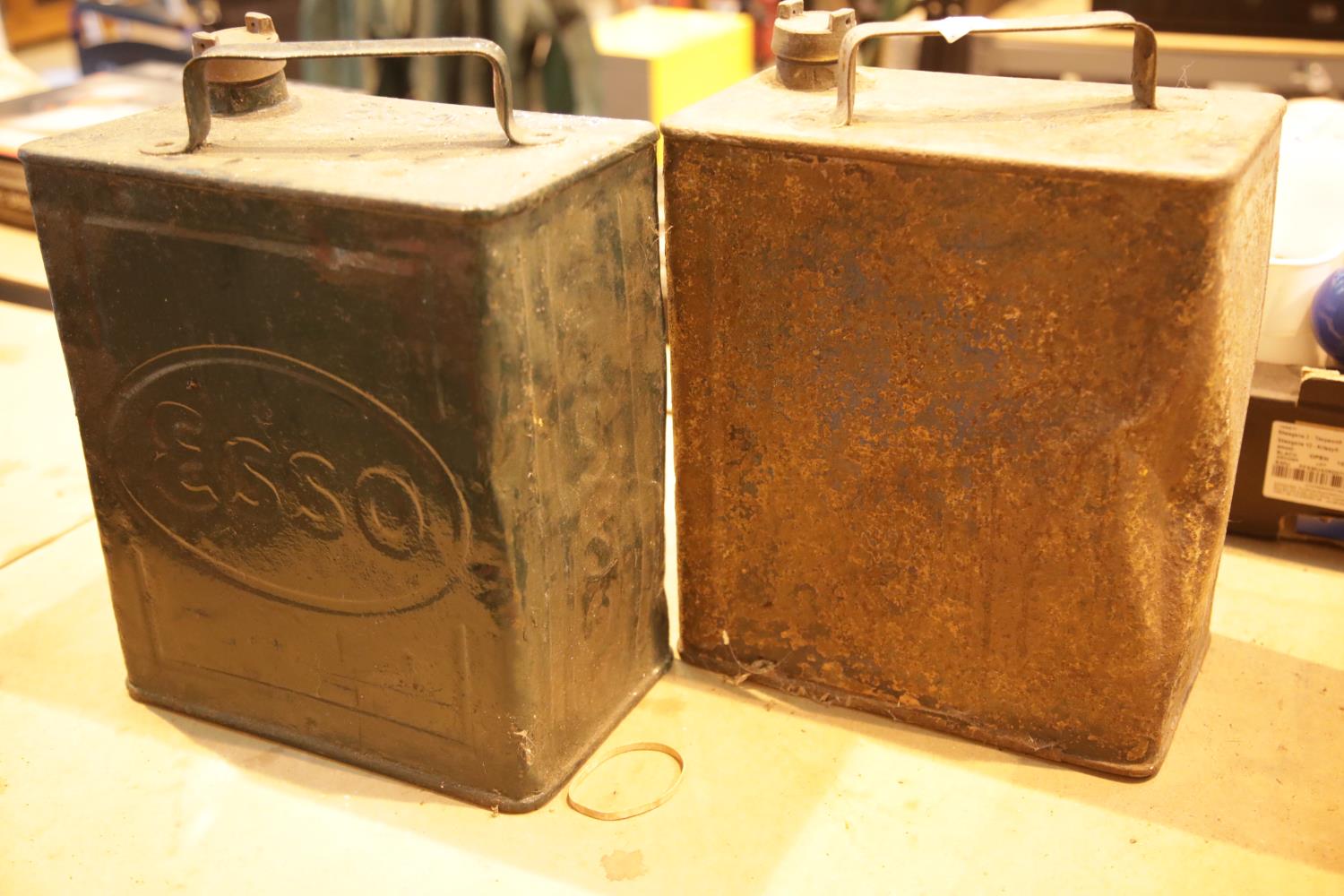 Two vintage petrol cans with brass tops, Esso and Light Shale Oil. This lot is not available for