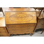 Walnut drop front bureau with fitted interior and three long drawers. This lot is not available