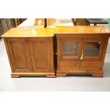 Modern two door panelled bookcase and a similar two door glazed media cabinet. This lot is not