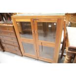 Modern two door glazed display cabinet with two glass shelves, H: 120 cm. This lot is not