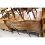 Regency style mahogany serpentine sideboard with three drawers and three cupboards. This lot is