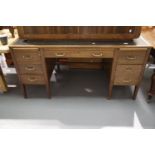 Early 20th century oak twin pedestal desk with green leather insert top and brass handles, 153 x