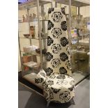 Contemporary oversized upholstered hall chair of asymmetric design, H: 182 cm. This lot is not