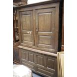 Georgian oak linen press with two doors over fixed base 125 x 187 cm H. This lot is not available