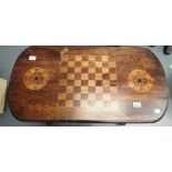 Antique walnut games table with inlaid chequered board and turned stretcher. This lot is not
