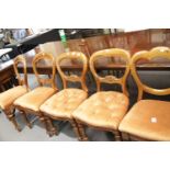 Two pairs of Victorian balloon back chairs with upholstered seats, and a further similar chair. This