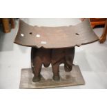 Ethnic hand carver ebony curved seat stool with elephant support base W: 90 cm. This lot is not