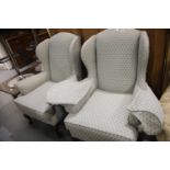 Pair of wingback upholstered armchairs with cabriole legs. This lot is not available for in-house