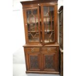 Edwardian glazed bookcase with two drawers and two cupboards 109 x 45 x 220 cm H. This lot is not