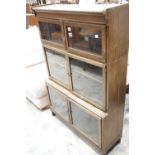 Three tier oak glazed bookcase. This lot is not available for in-house P&P