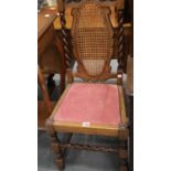 Antique heavily carved hallway chair with lattice back and barley twist supports and stretchers.