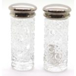 Two crystal pots with hallmarked silver tops. P&P Group 2 (£18+VAT for the first lot and £2+VAT