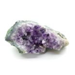 Piece of raw amethyst stone, L: 10 cm. P&P Group 2 (£18+VAT for the first lot and £2+VAT for